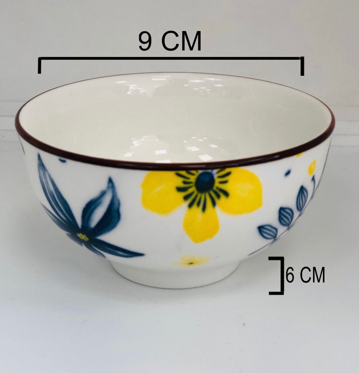 Small ceramic dish with yellow and blue flowers