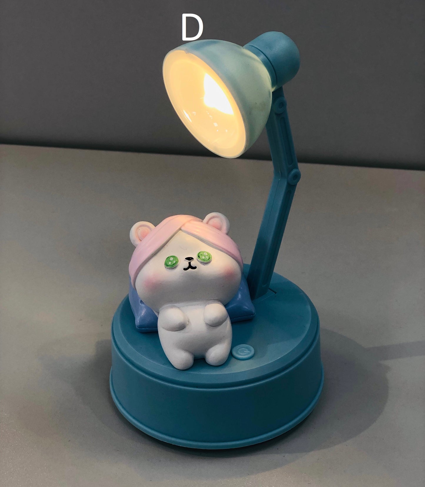 Table lamp, small size, blue plastic, with a masterpiece