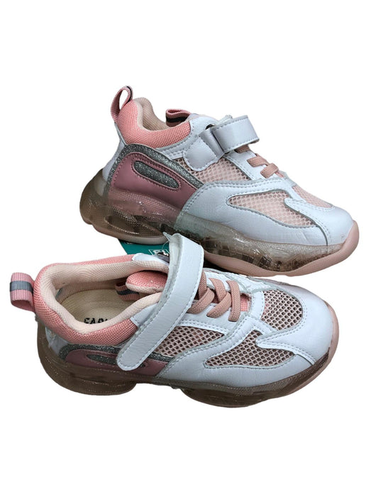 Pink and white children's shoes with an opening at the back