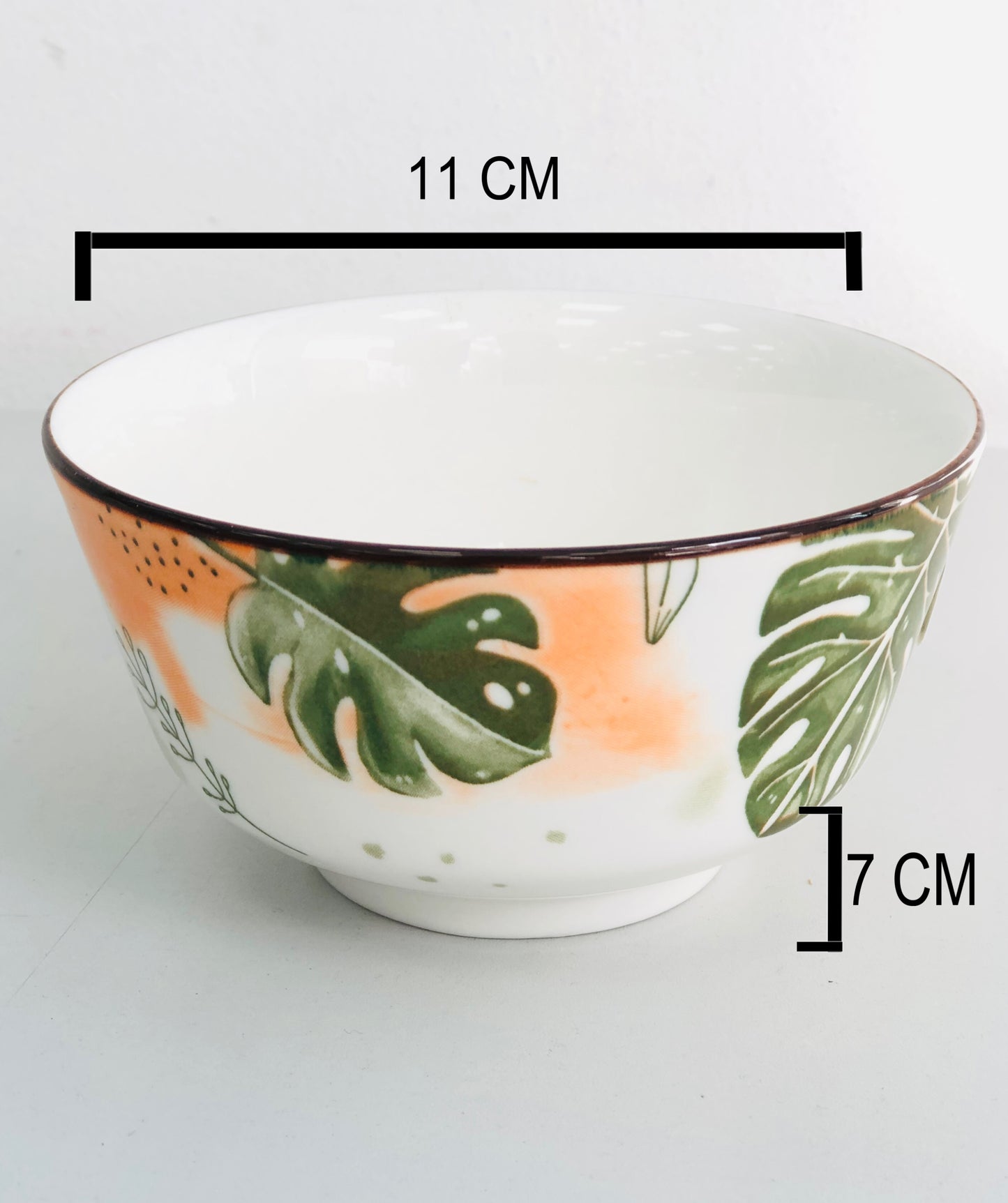 Ceramic plate covered with green and orange leaves