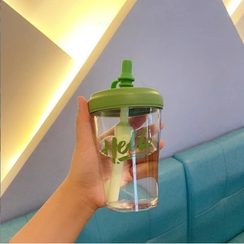 Plastic cup with straw and lid