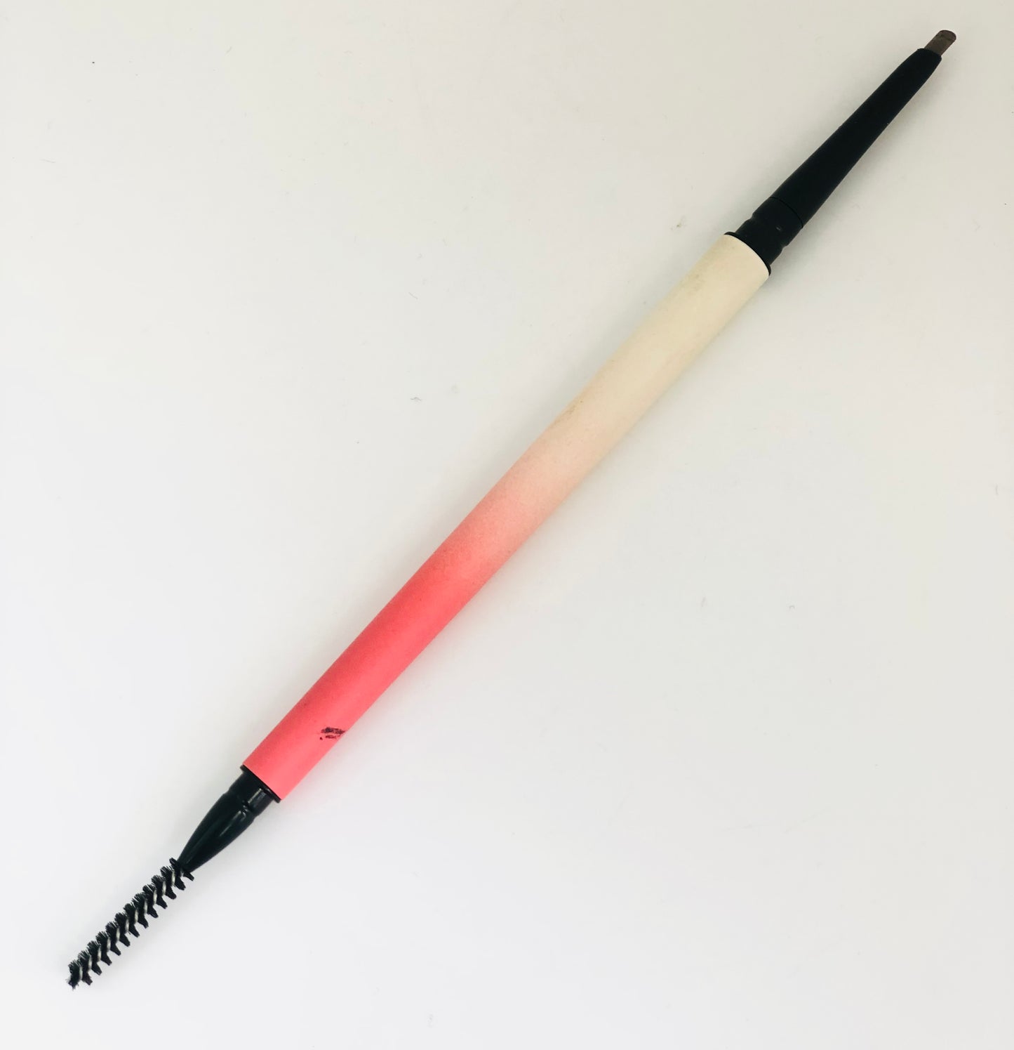 Double-sided eyebrow pencil with comb
