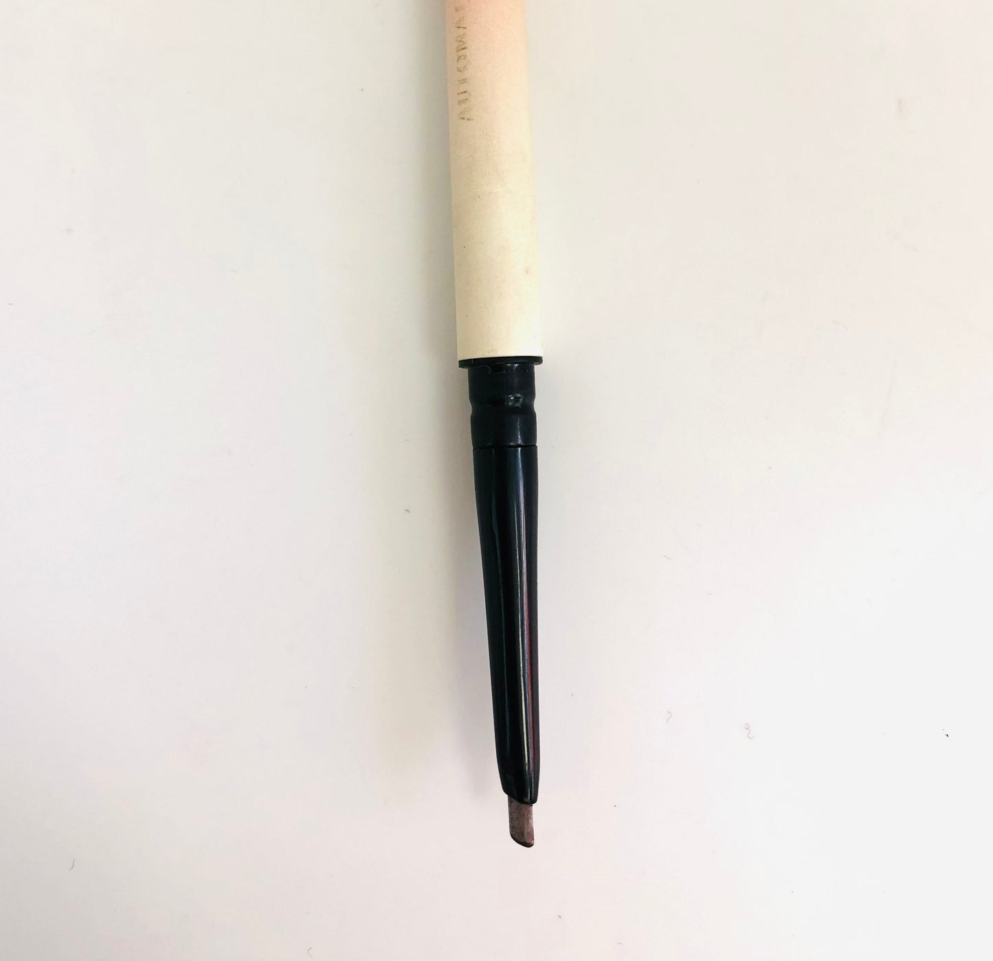 Double-sided eyebrow pencil with comb