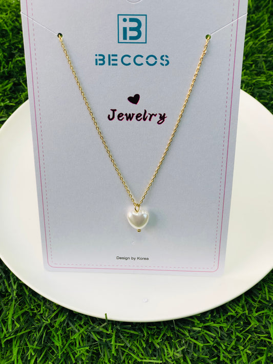 A long necklace with a gold and silver heart