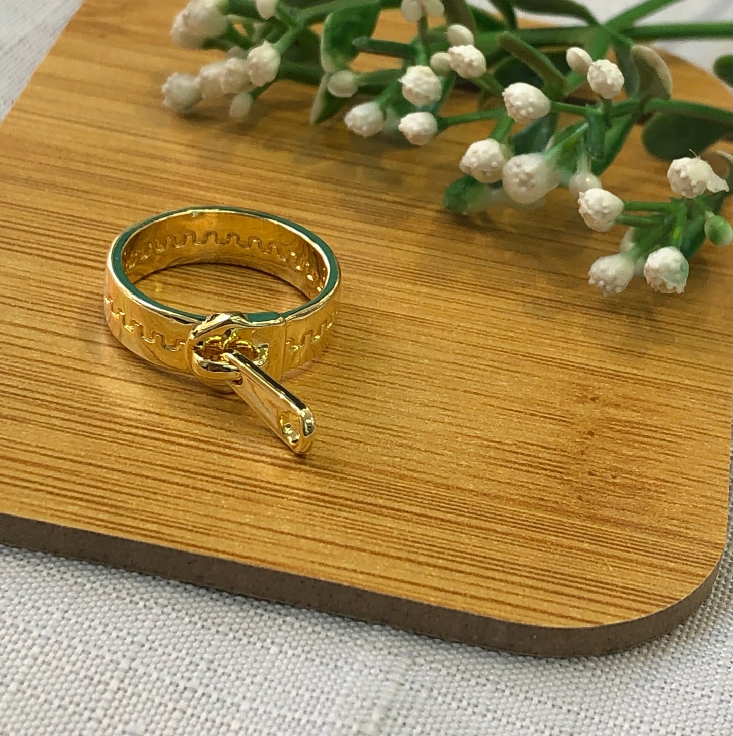 Golden ring in the shape of a cloud