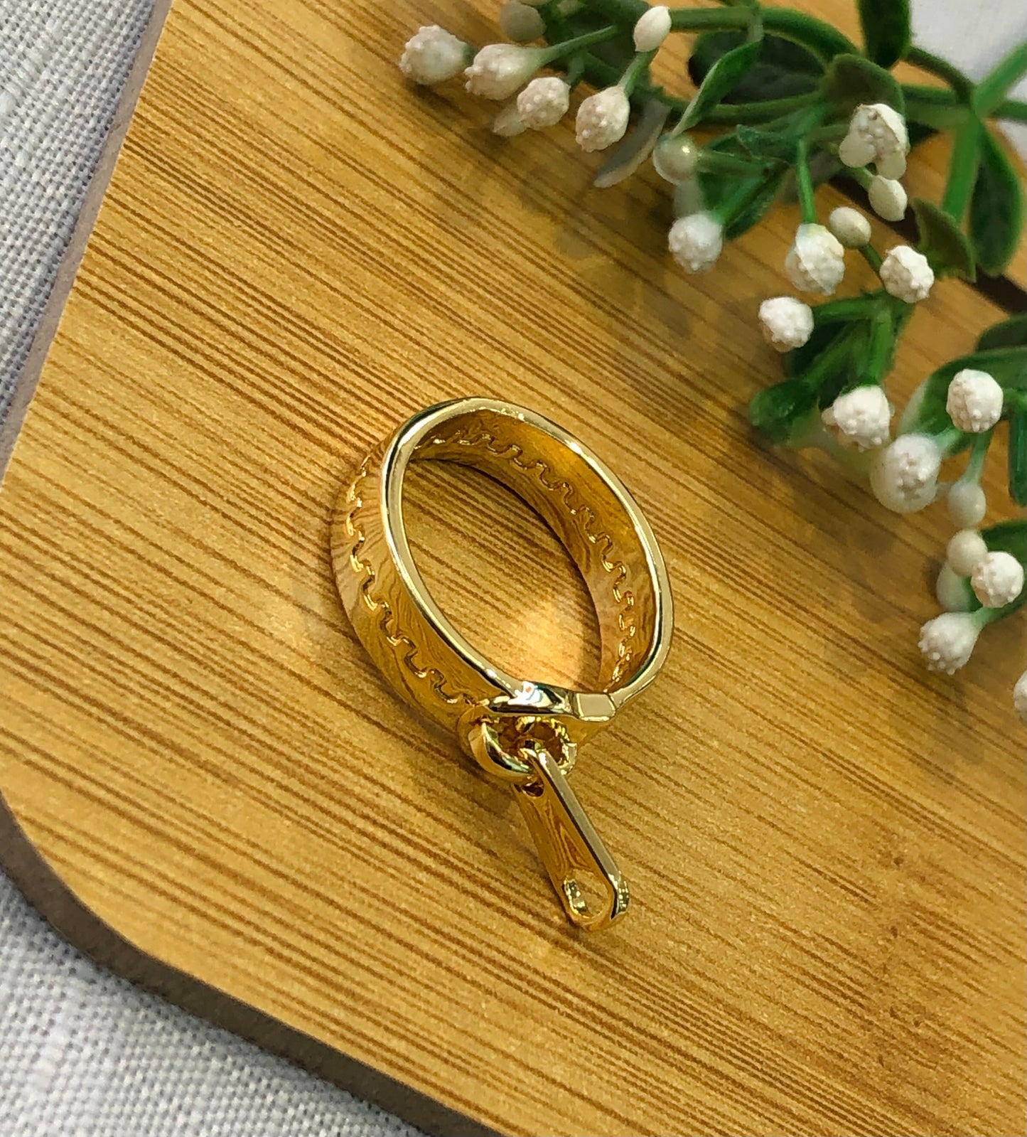 Golden ring in the shape of a cloud