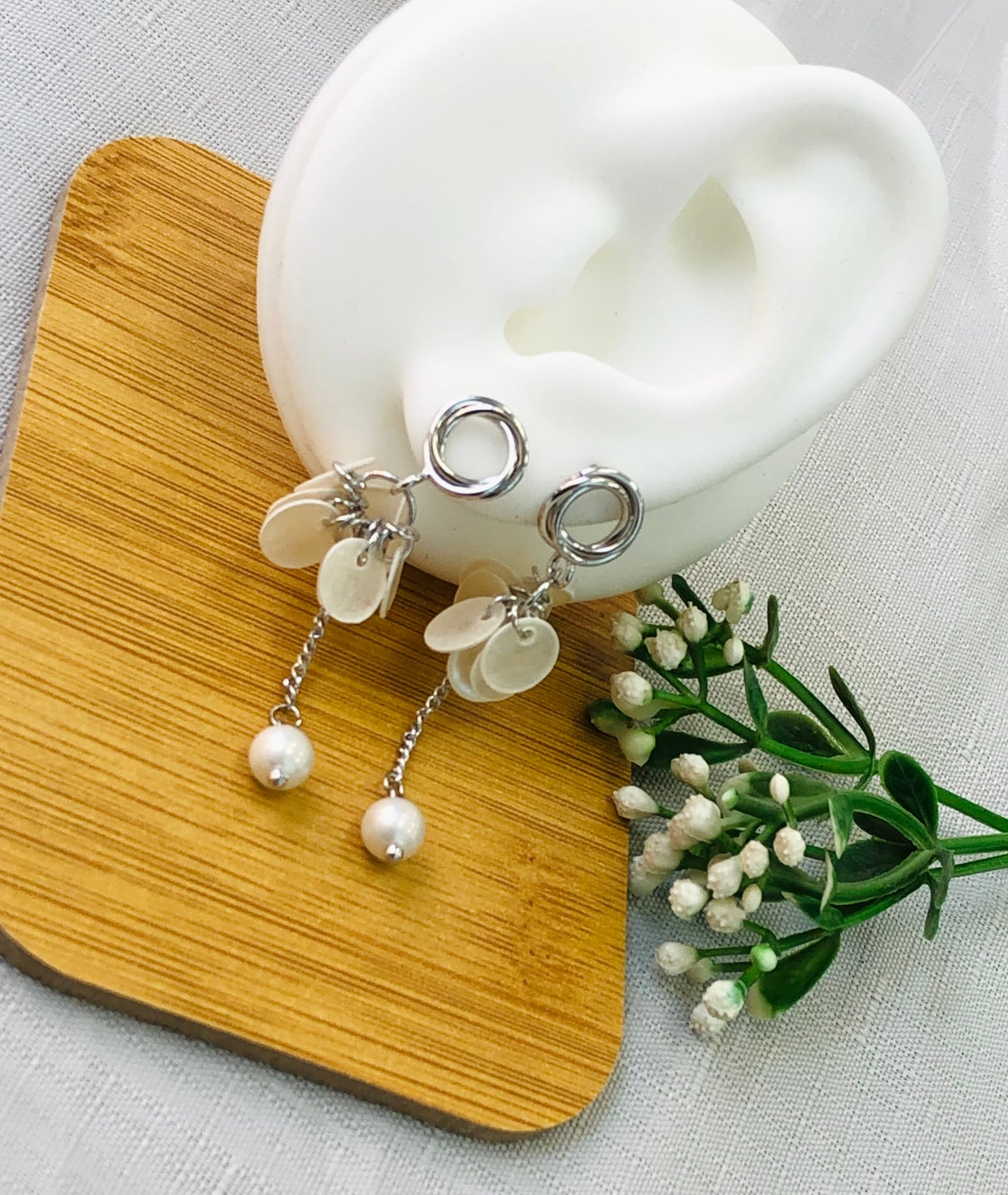 Long earring with gold and silver rings