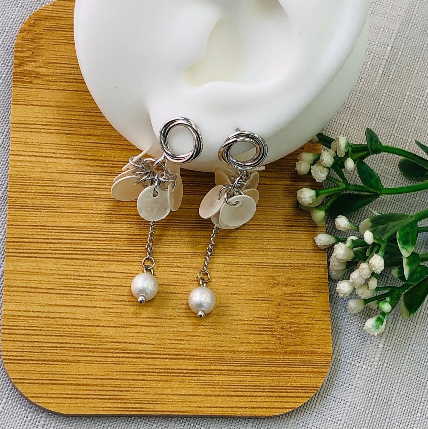Long earring with gold and silver rings