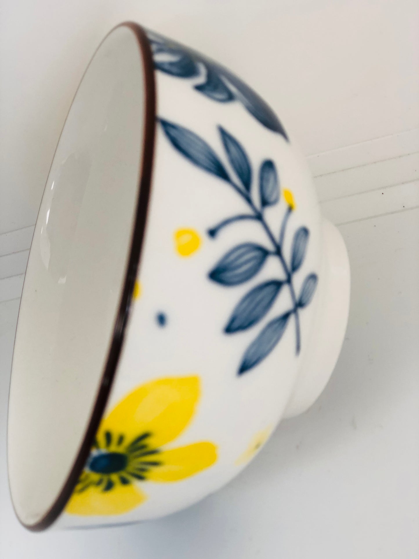 Small ceramic dish with yellow and blue flowers