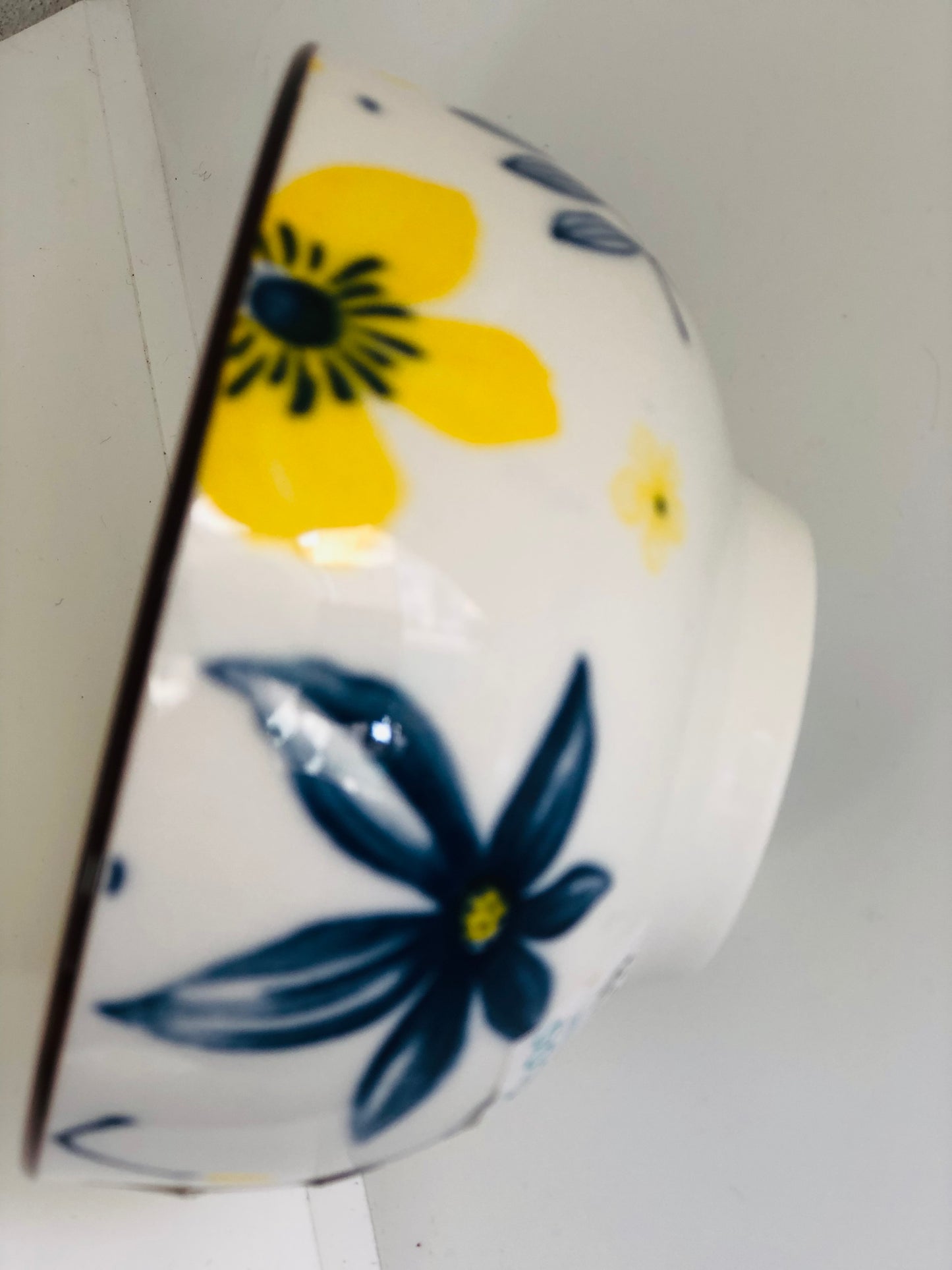 Small ceramic dish with yellow and blue flowers