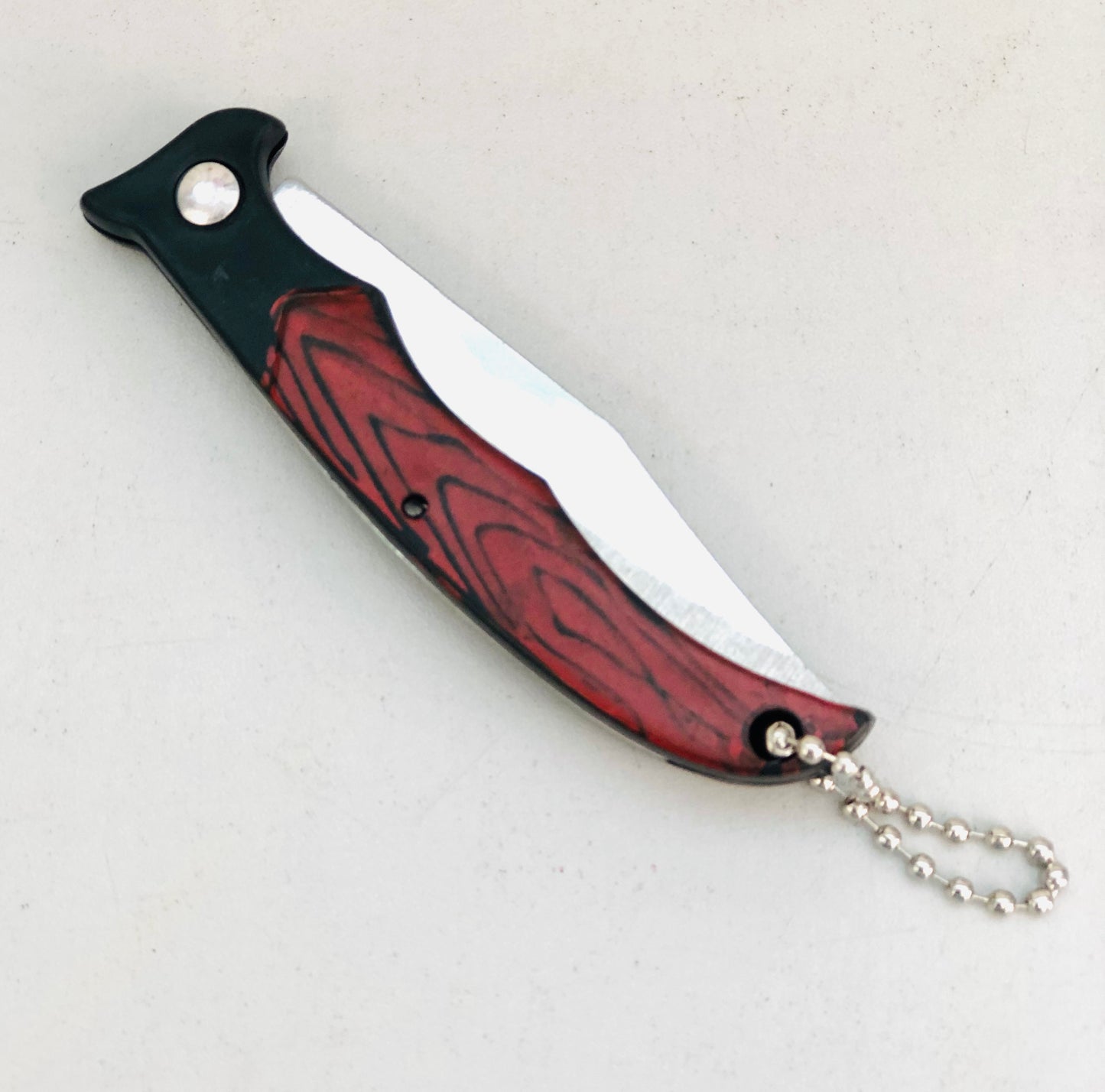 Steel razor with foldable wooden handle
