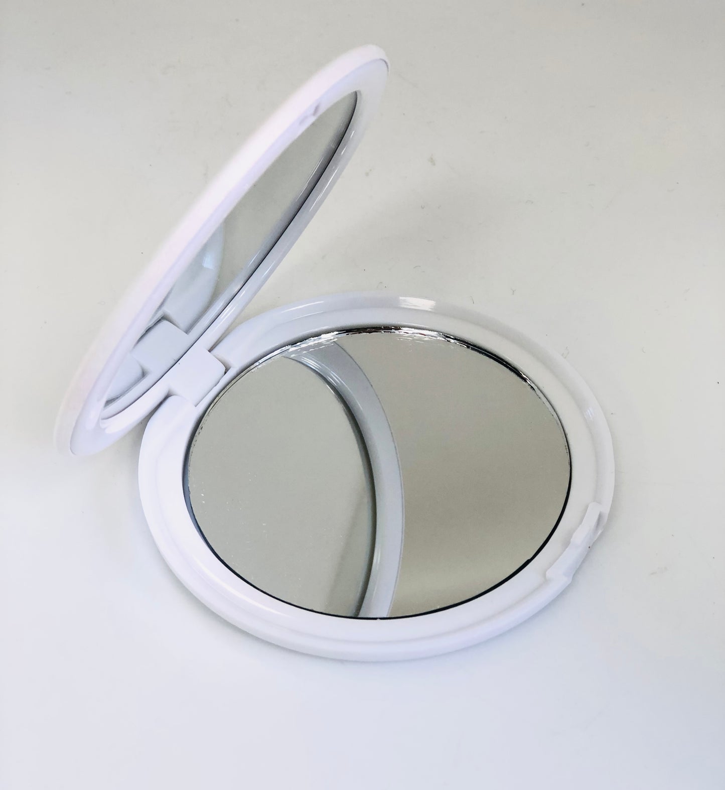 Small circular mirror, leaves