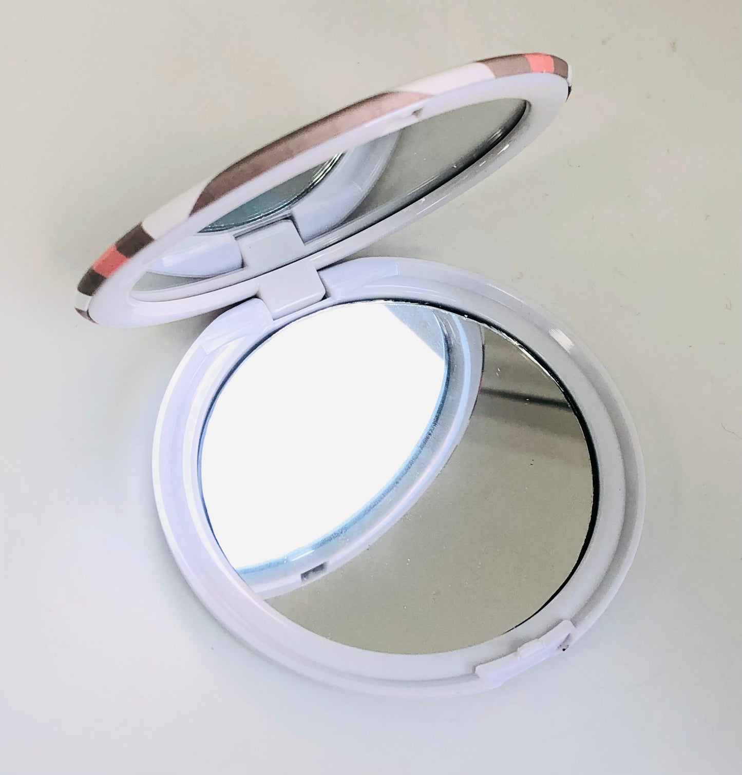 Small circular striped mirror