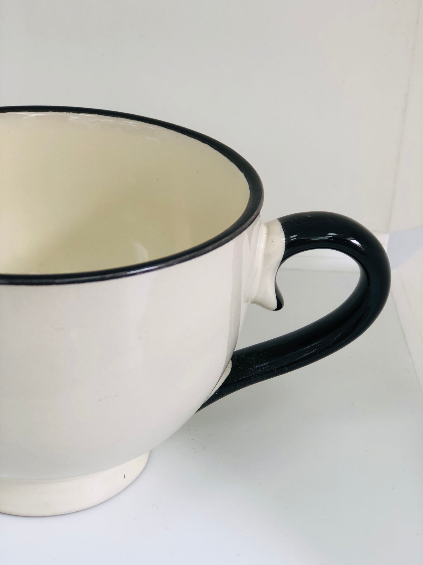 Beige and brown circular ceramic mug