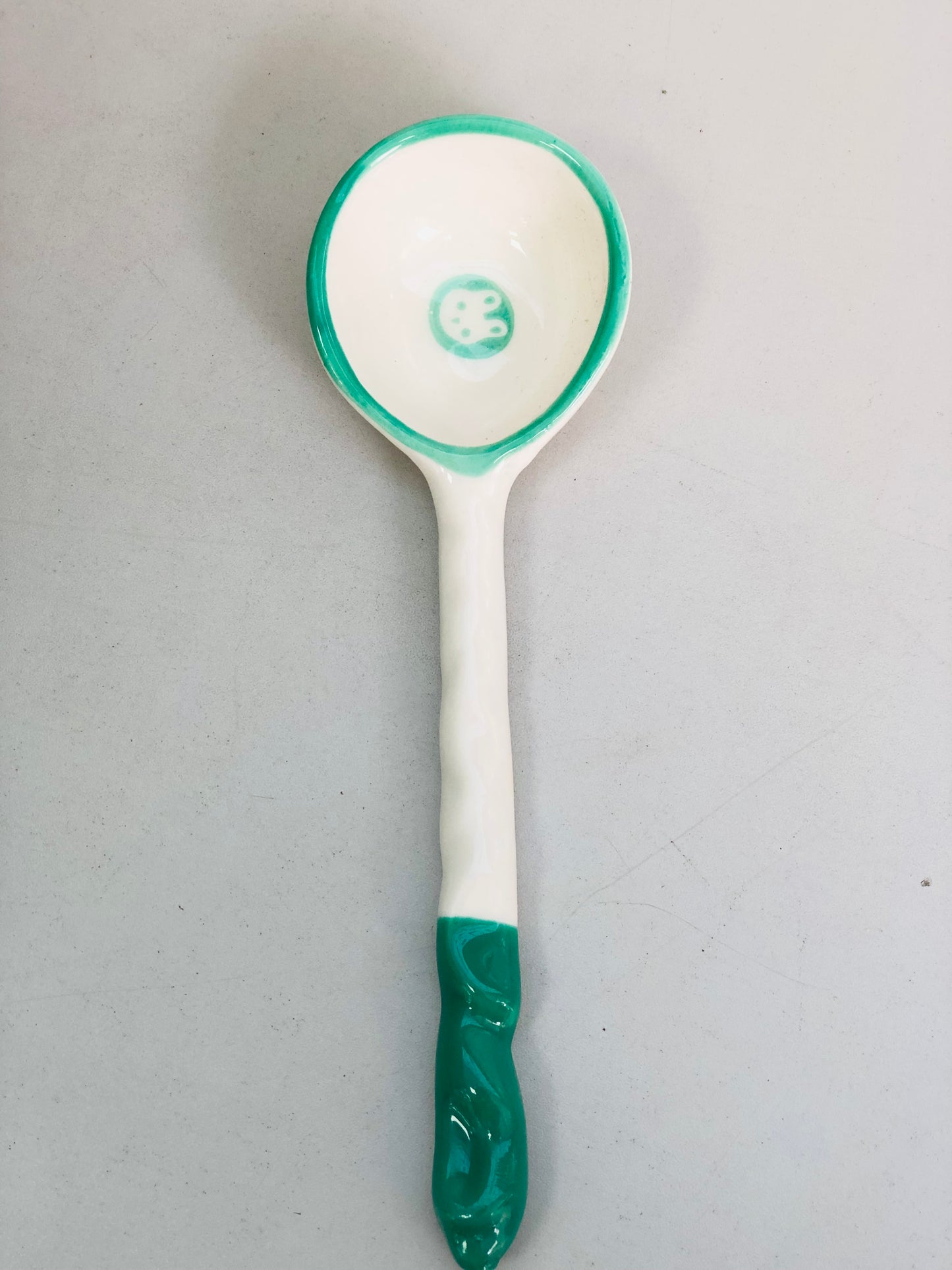 Green and white ceramic rabbit spoon