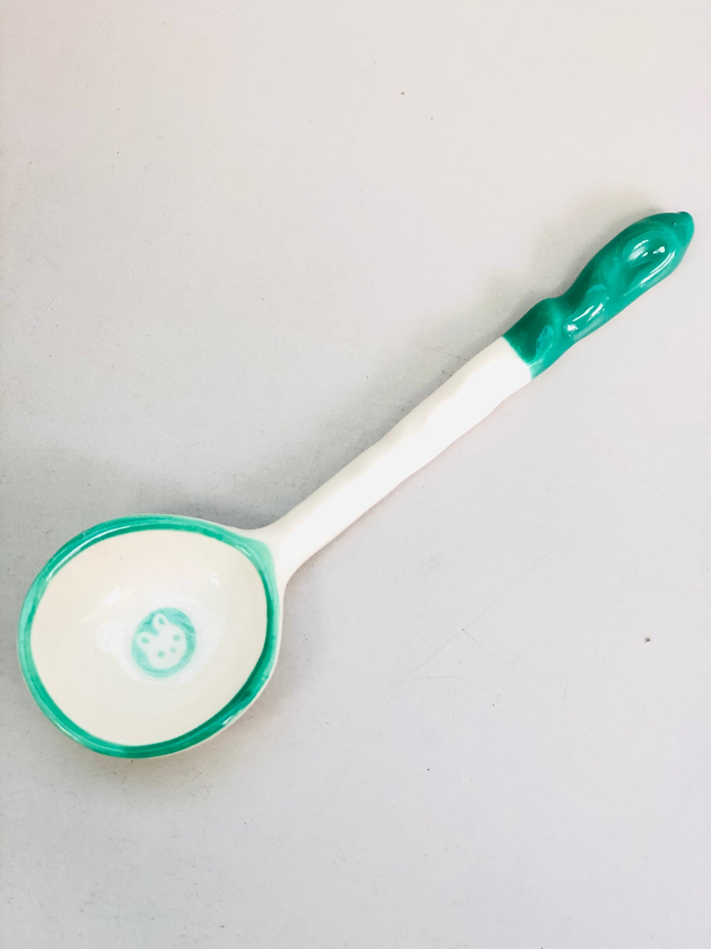 Green and white ceramic rabbit spoon