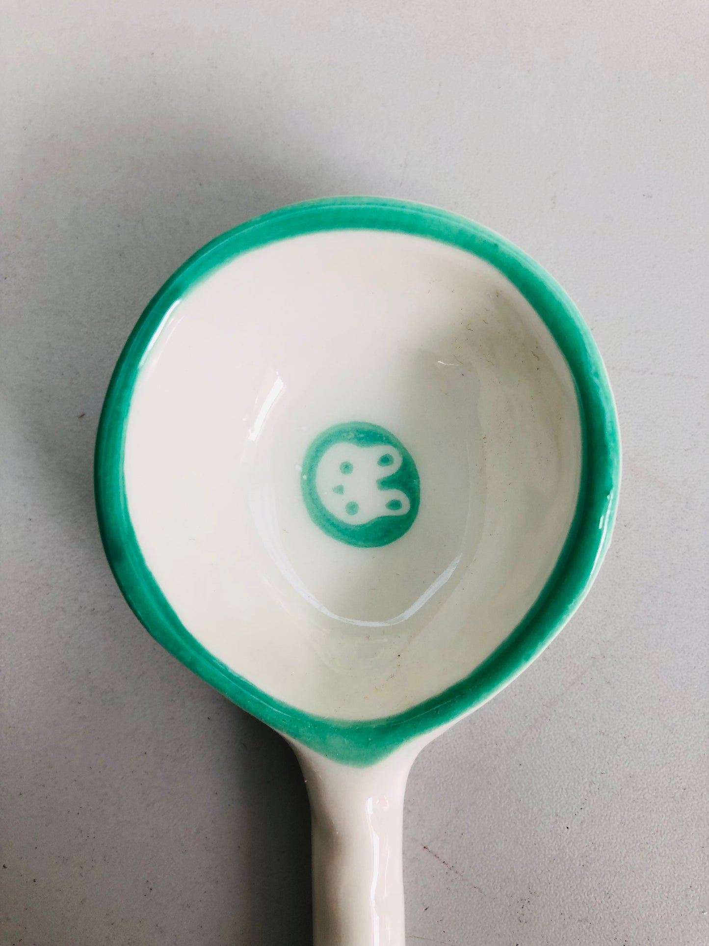 Green and white ceramic rabbit spoon