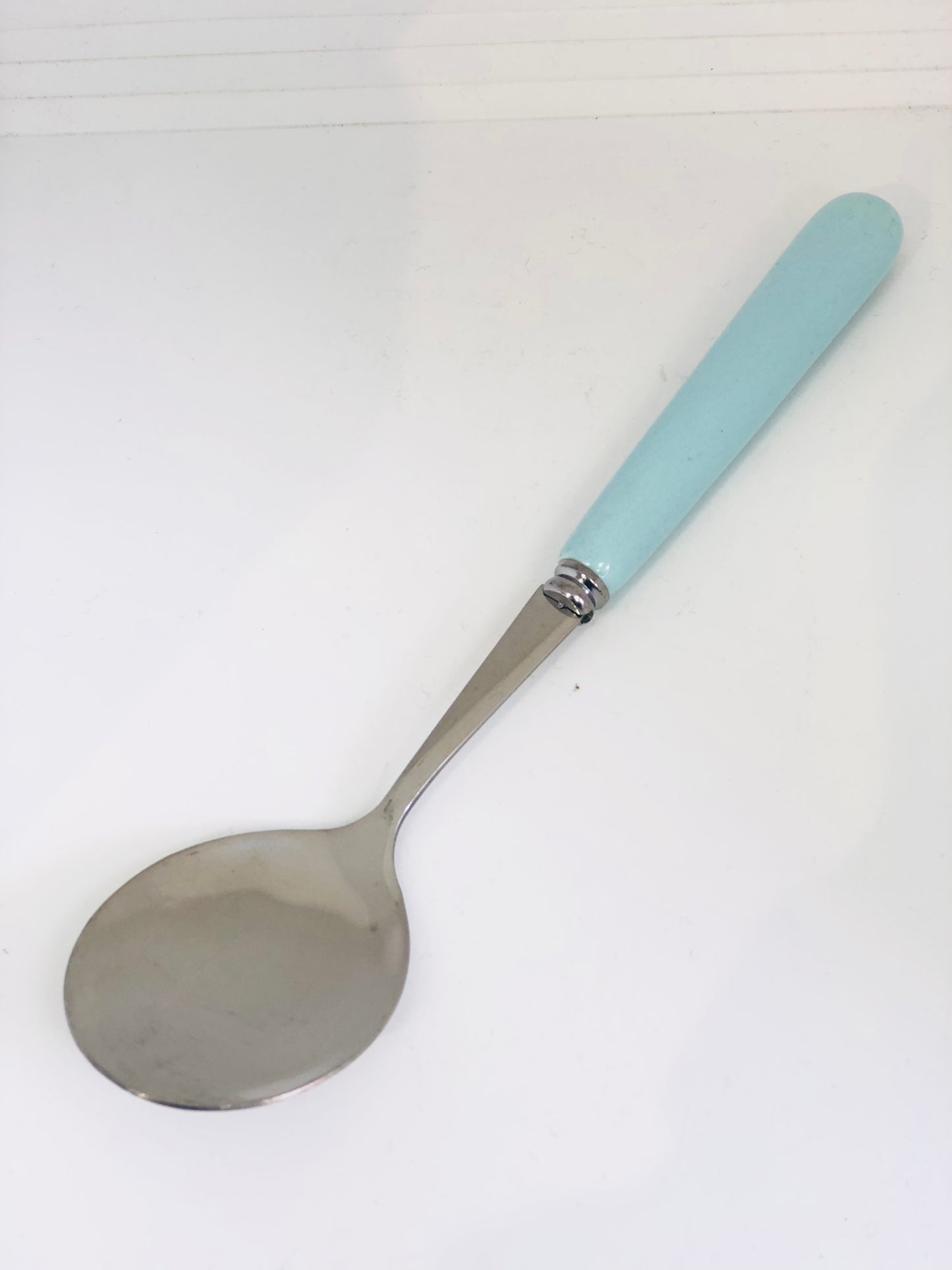 Light blue ceramic spoon