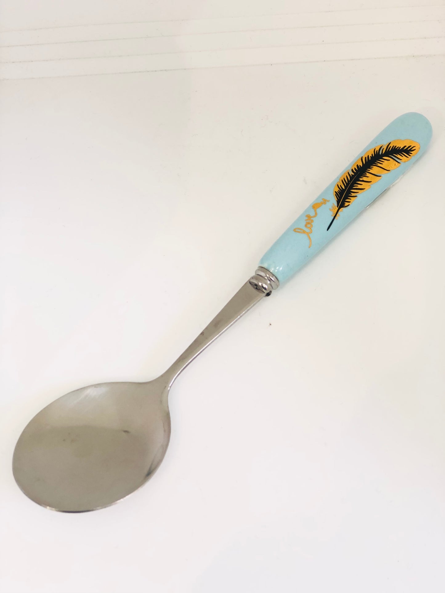 Light blue ceramic spoon