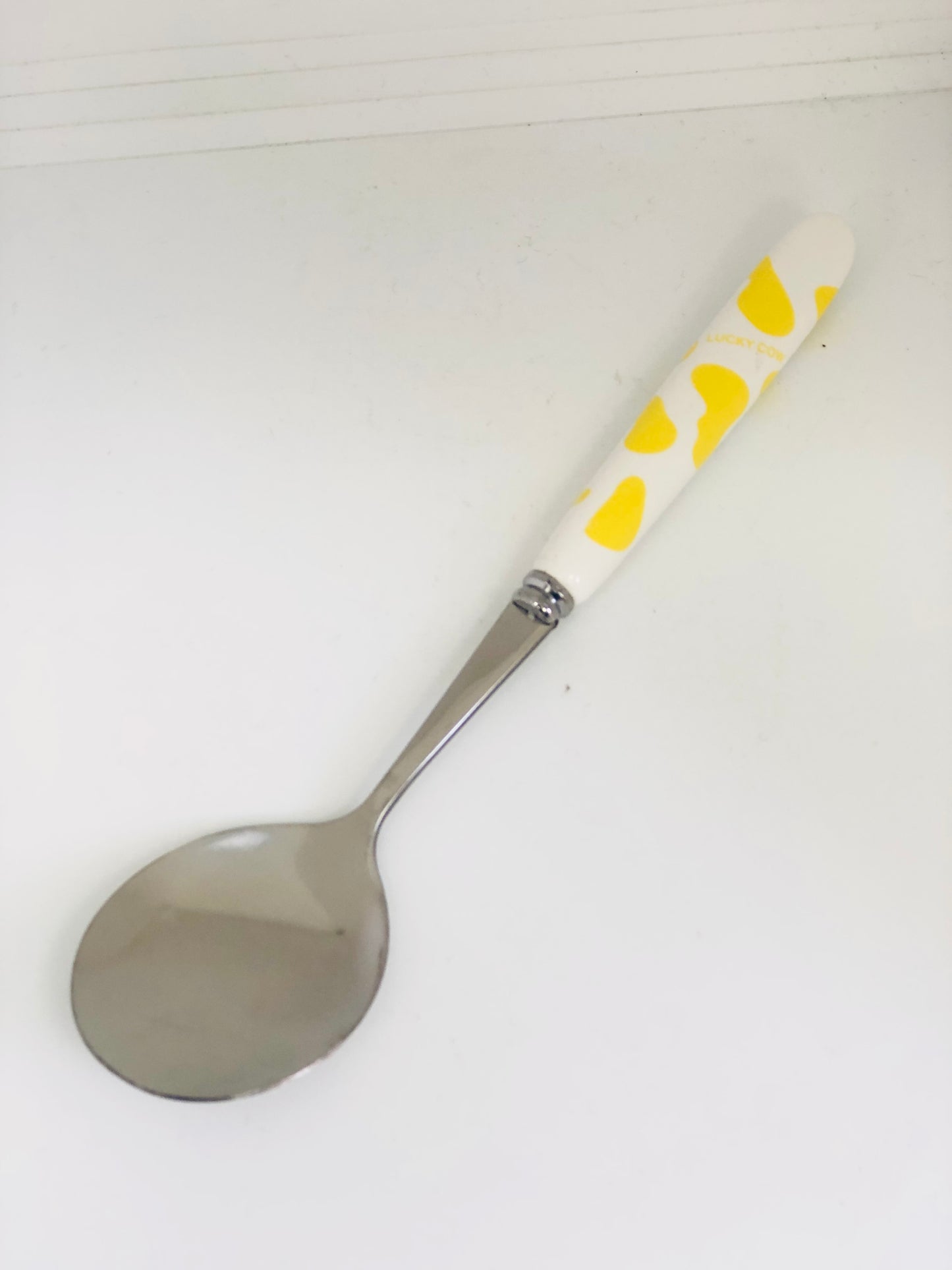 Yellow and white ceramic spoon and fork set