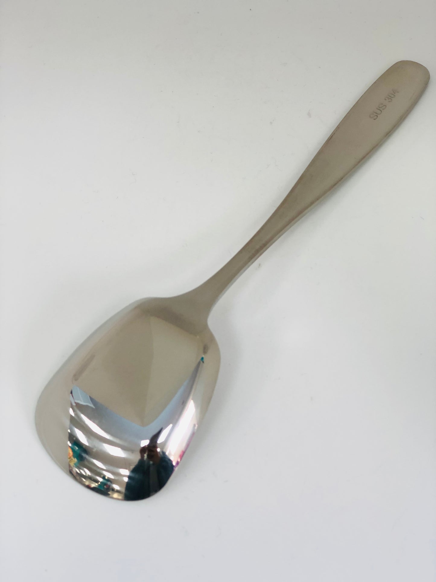 Stainless spoon with square head