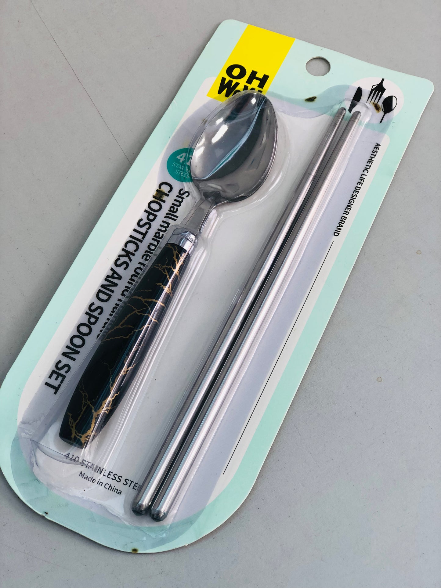 Iron chopsticks with black ceramic spoon