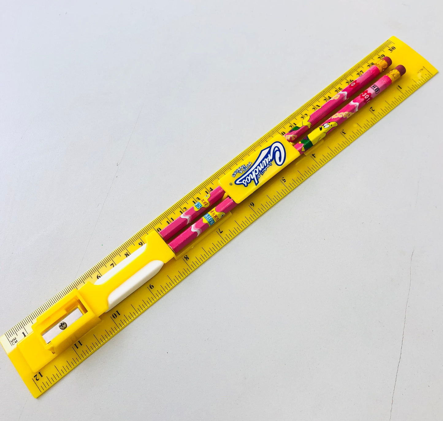 Plastic ruler with two pens, sharpener and eraser