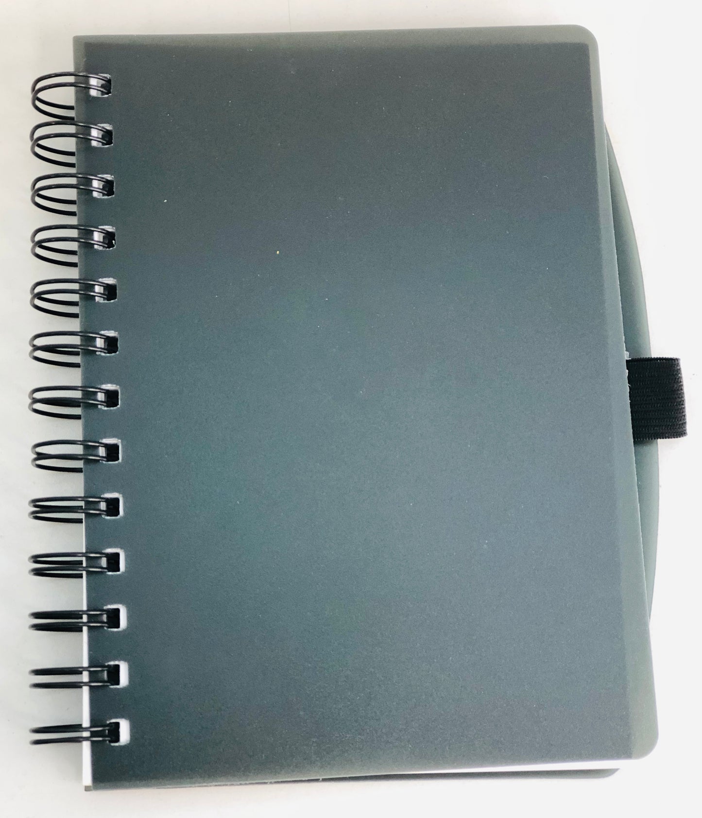 Black wire notebook with a place to put a pen