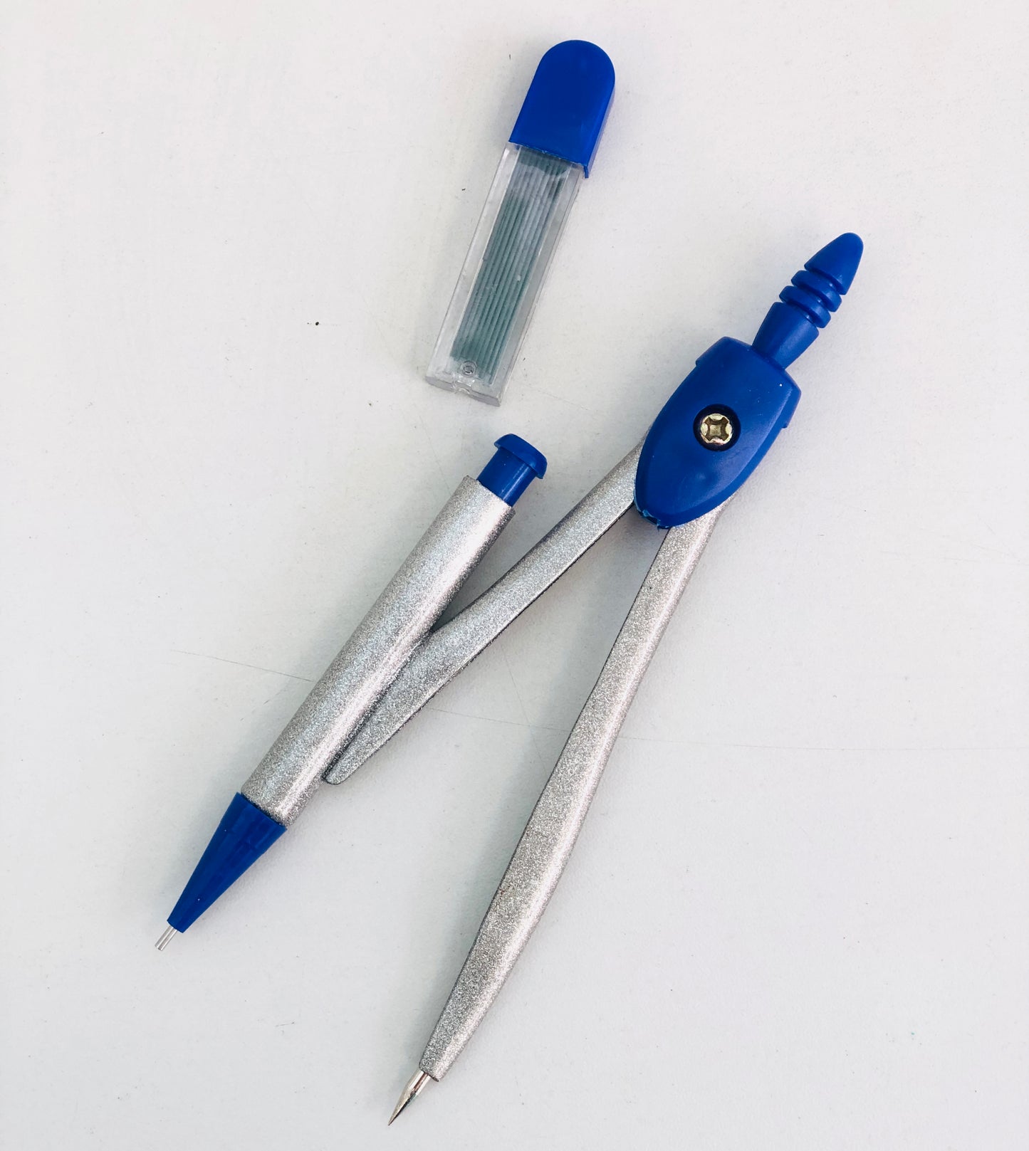 Metal compass with sharpener