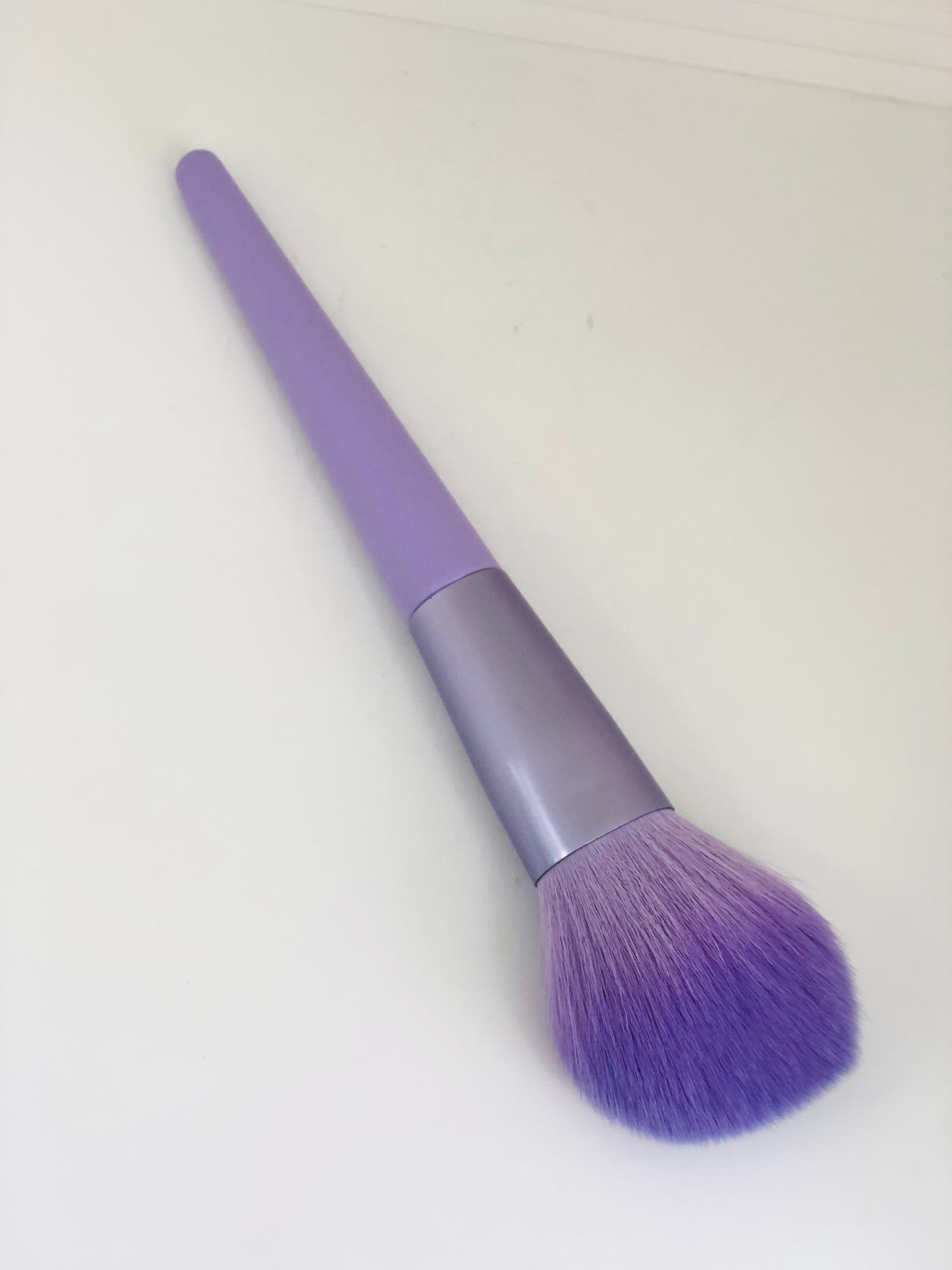 Soft purple makeup brush