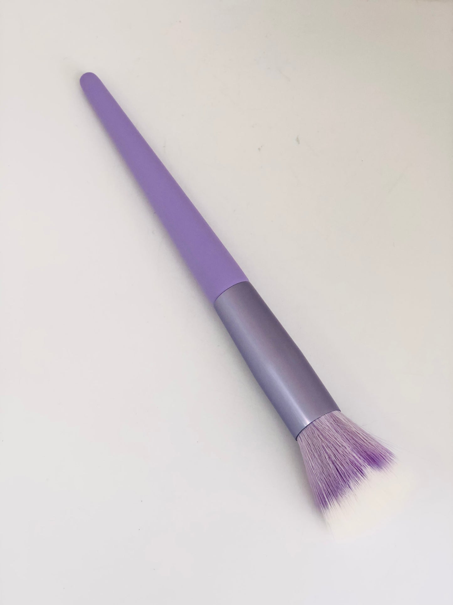 Medium purple makeup brush