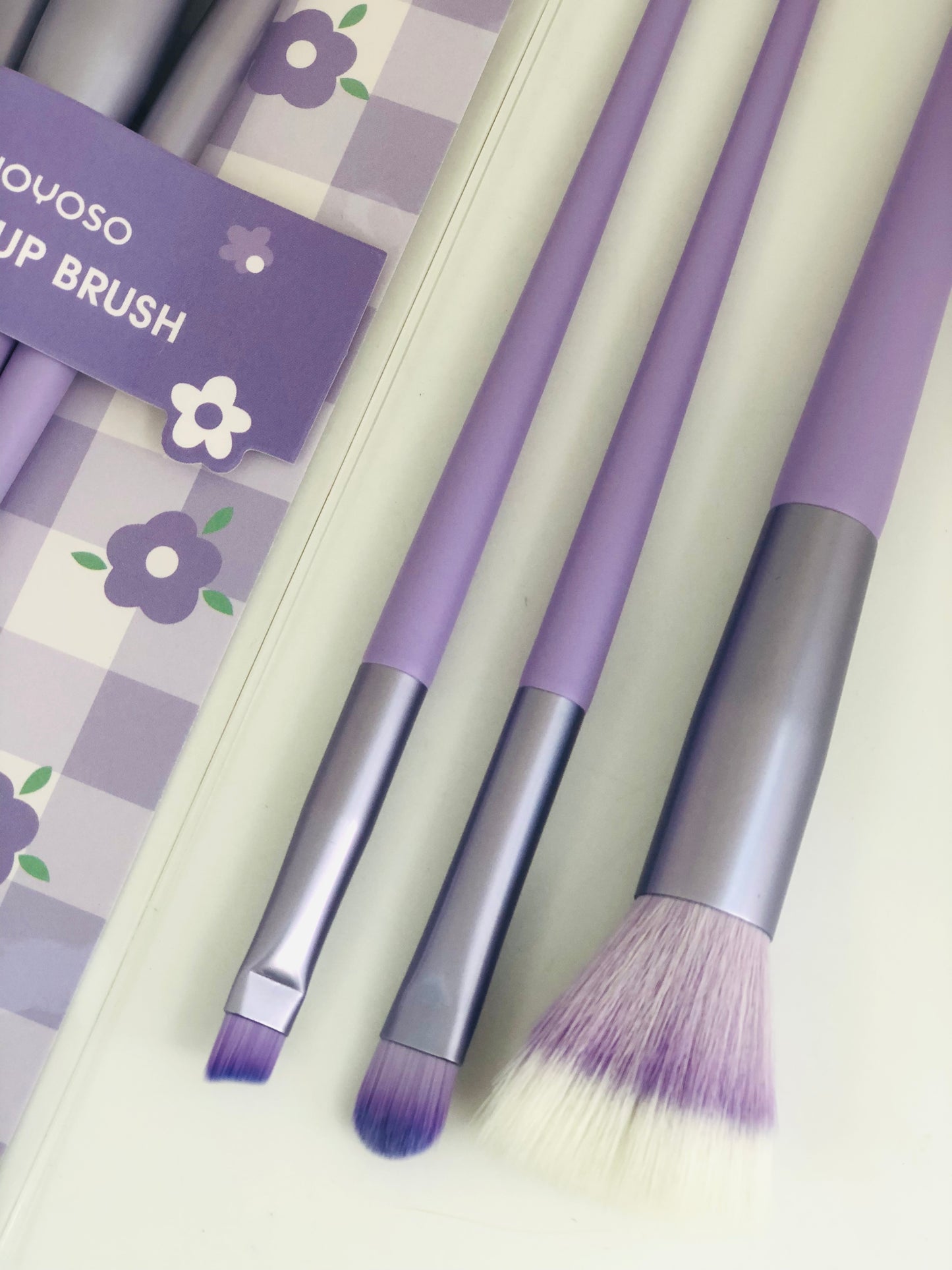 A package of mixed purple brushes