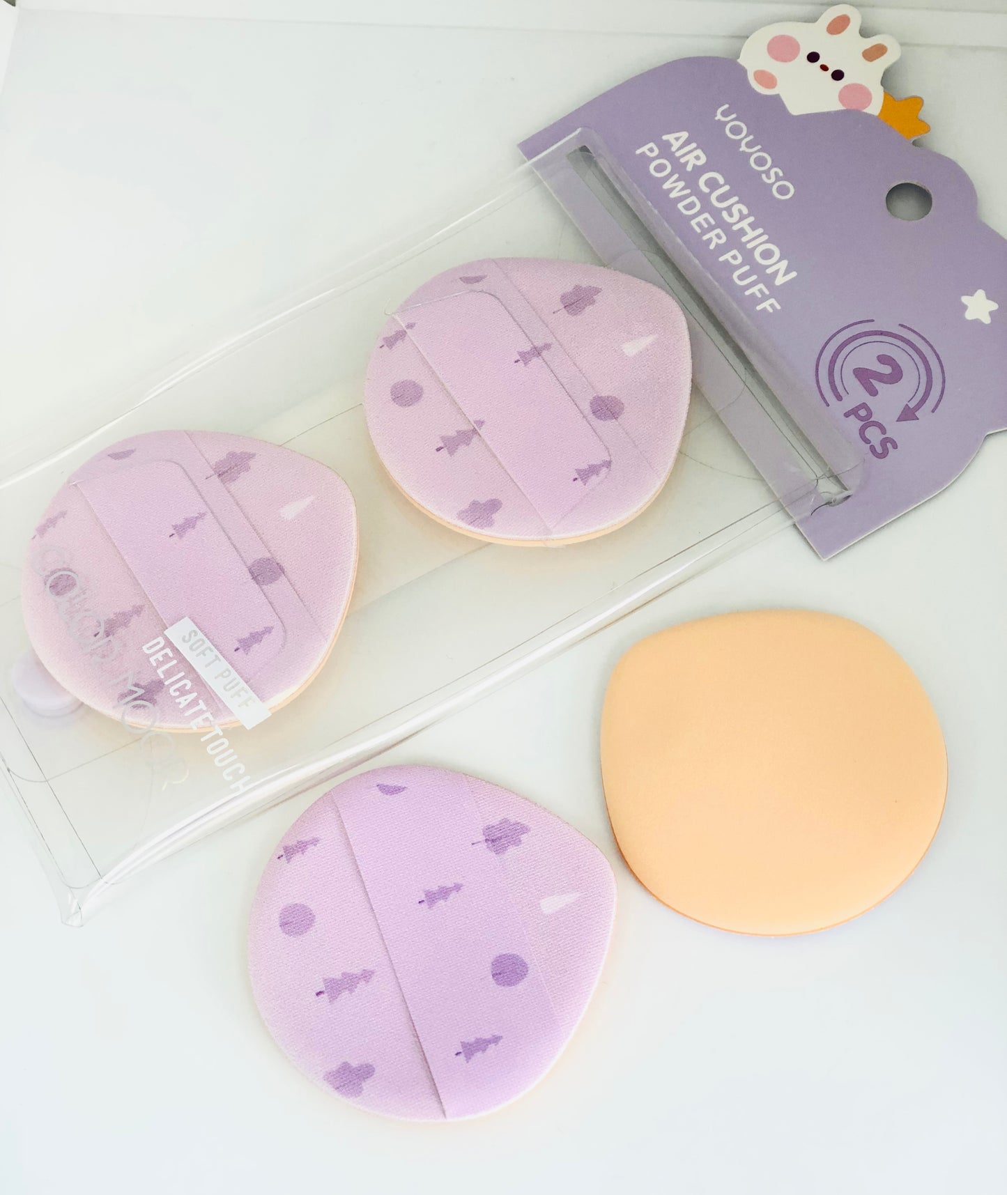 2 purple makeup sponges