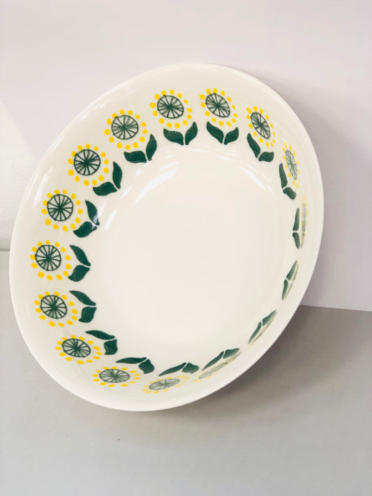 Ceramic dish with yellow and green pattern, 7 inches