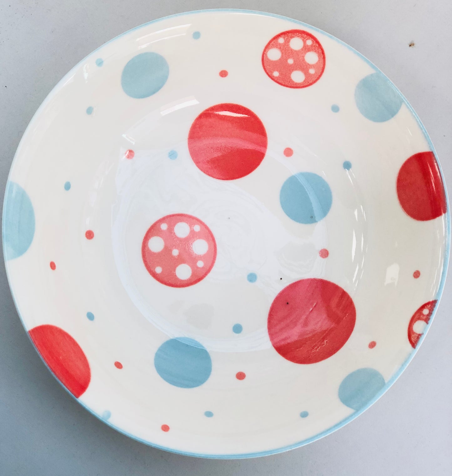 Ceramic plate with rounded circles, 7 inches