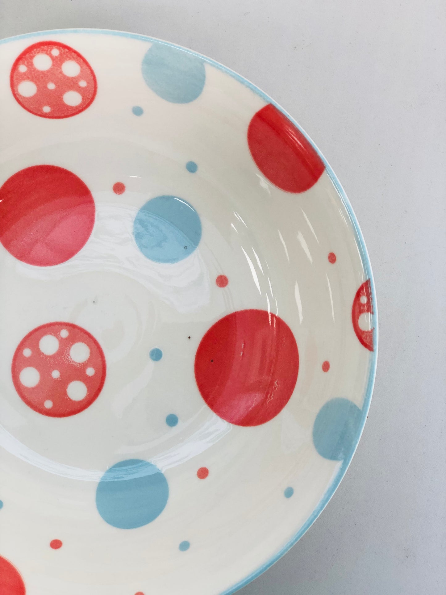 Ceramic plate with rounded circles, 7 inches
