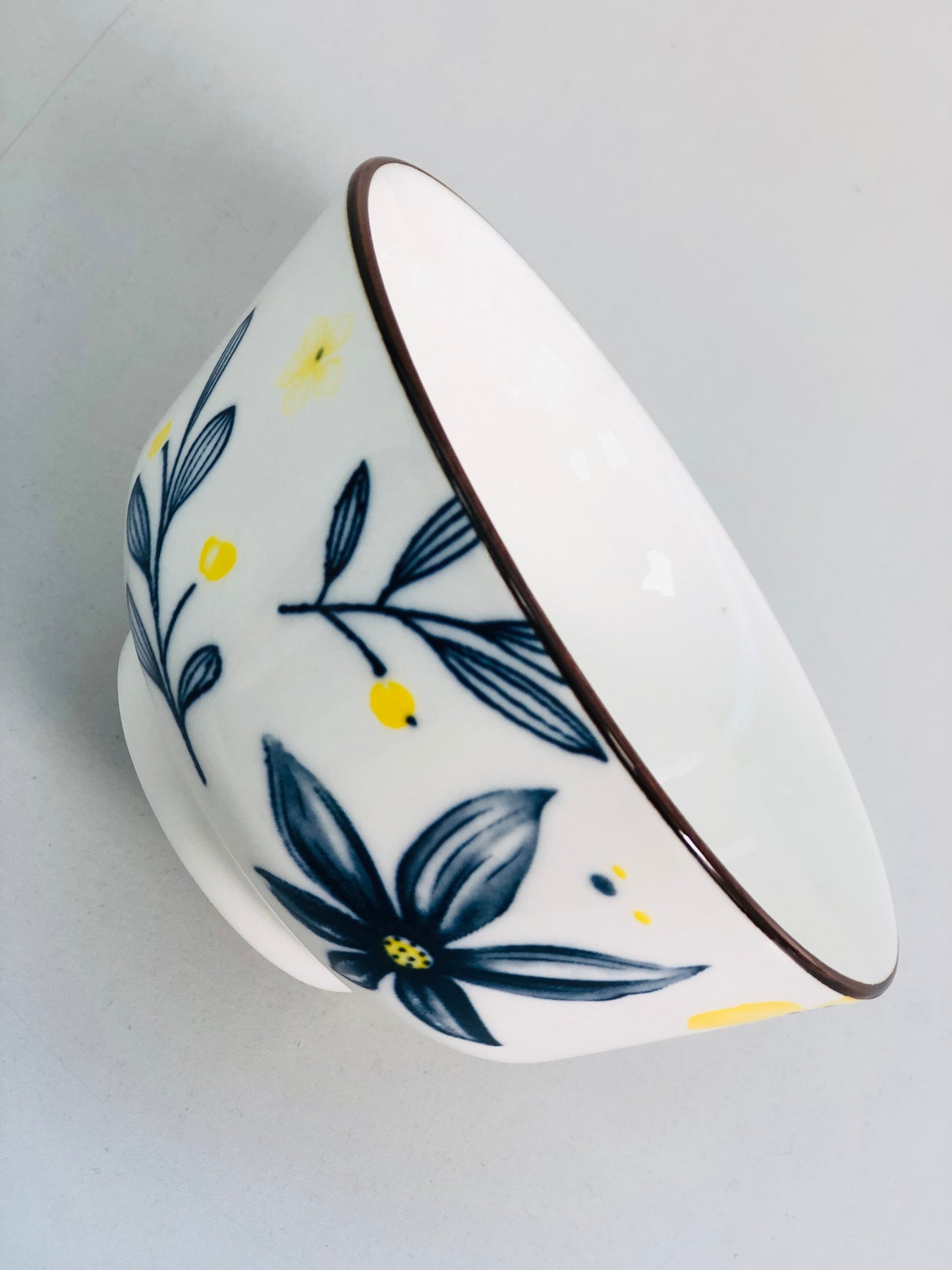 Ceramic dish with blue and yellow flowers