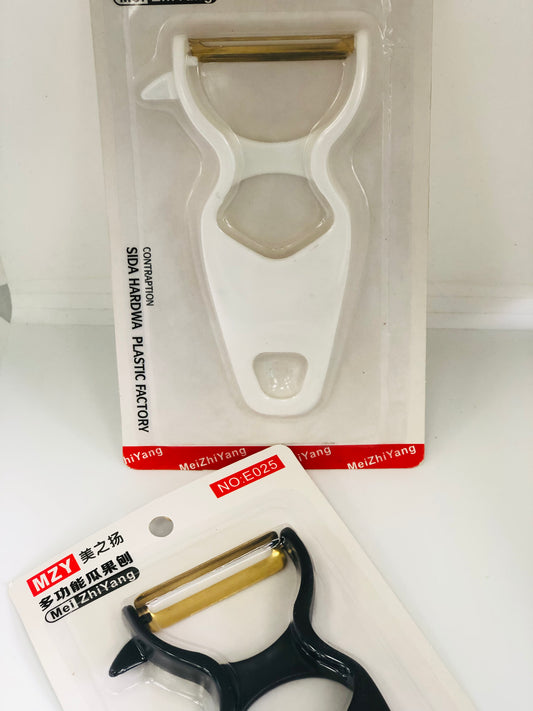 Black and white food peeler
