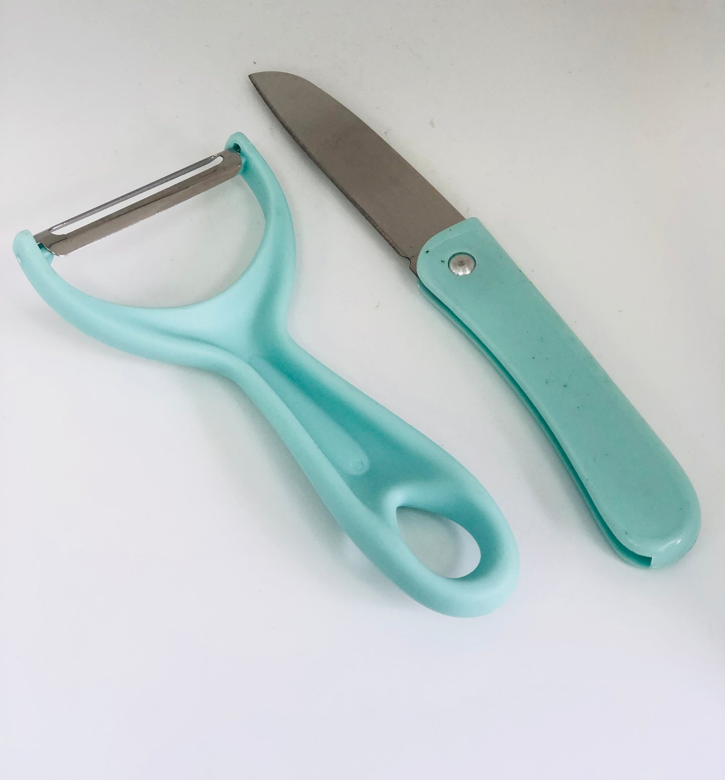 Food peeler with knife