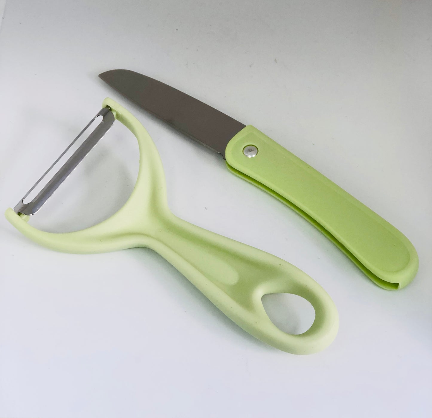 Food peeler with knife