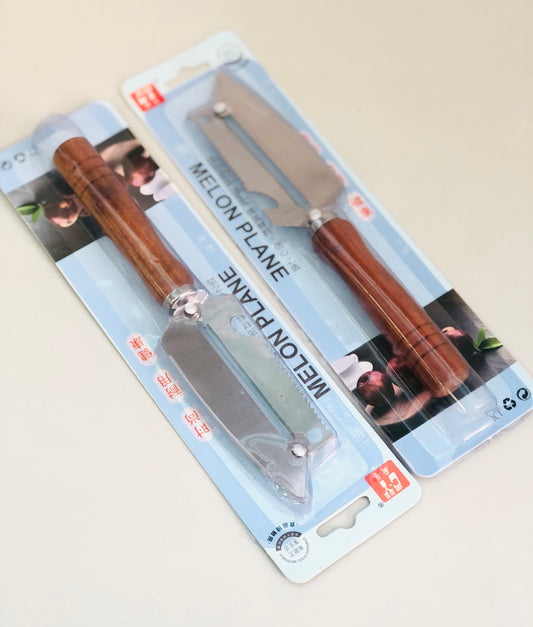 Knife with wooden handle peeler