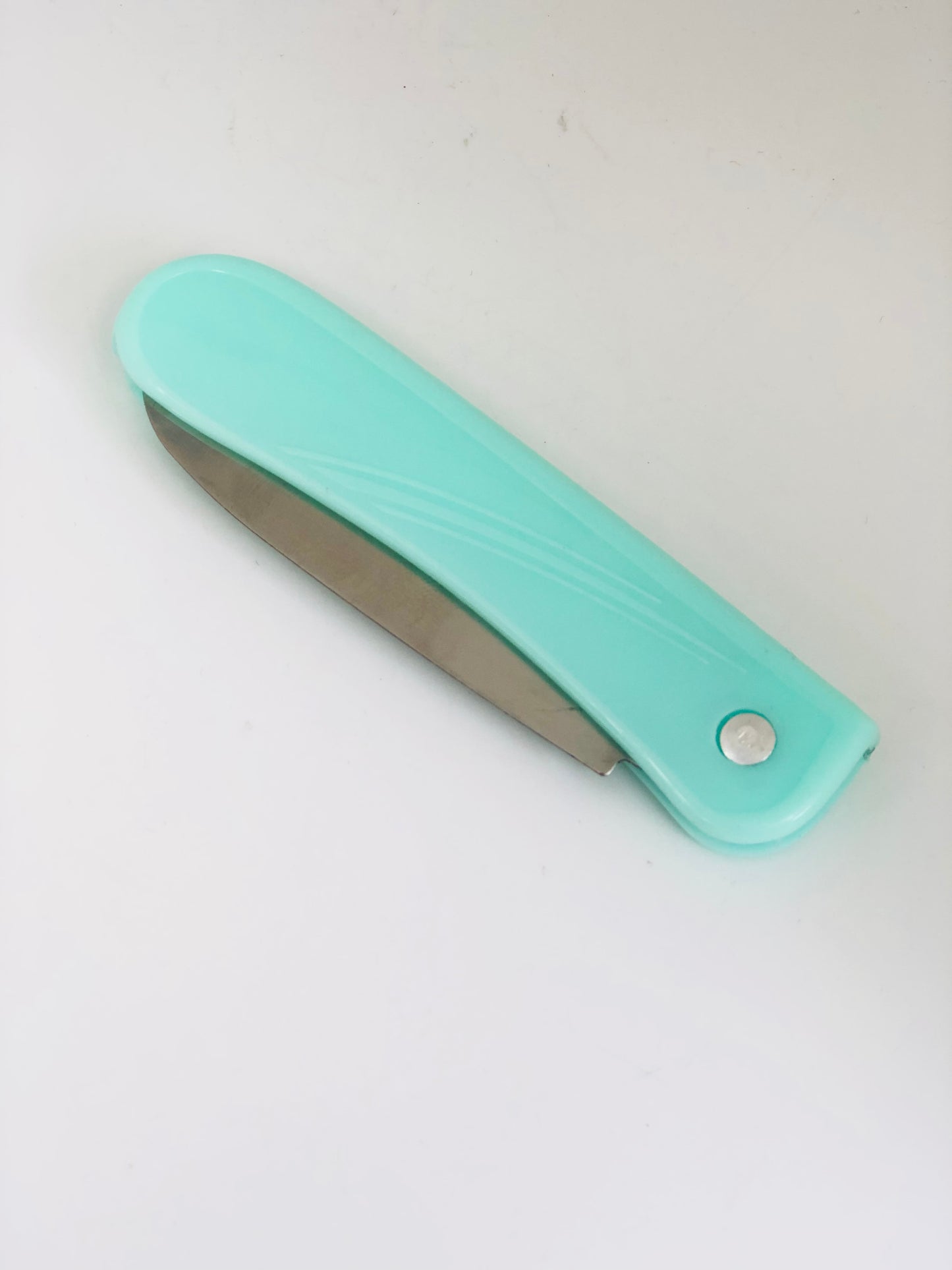 Peeler with folding knife