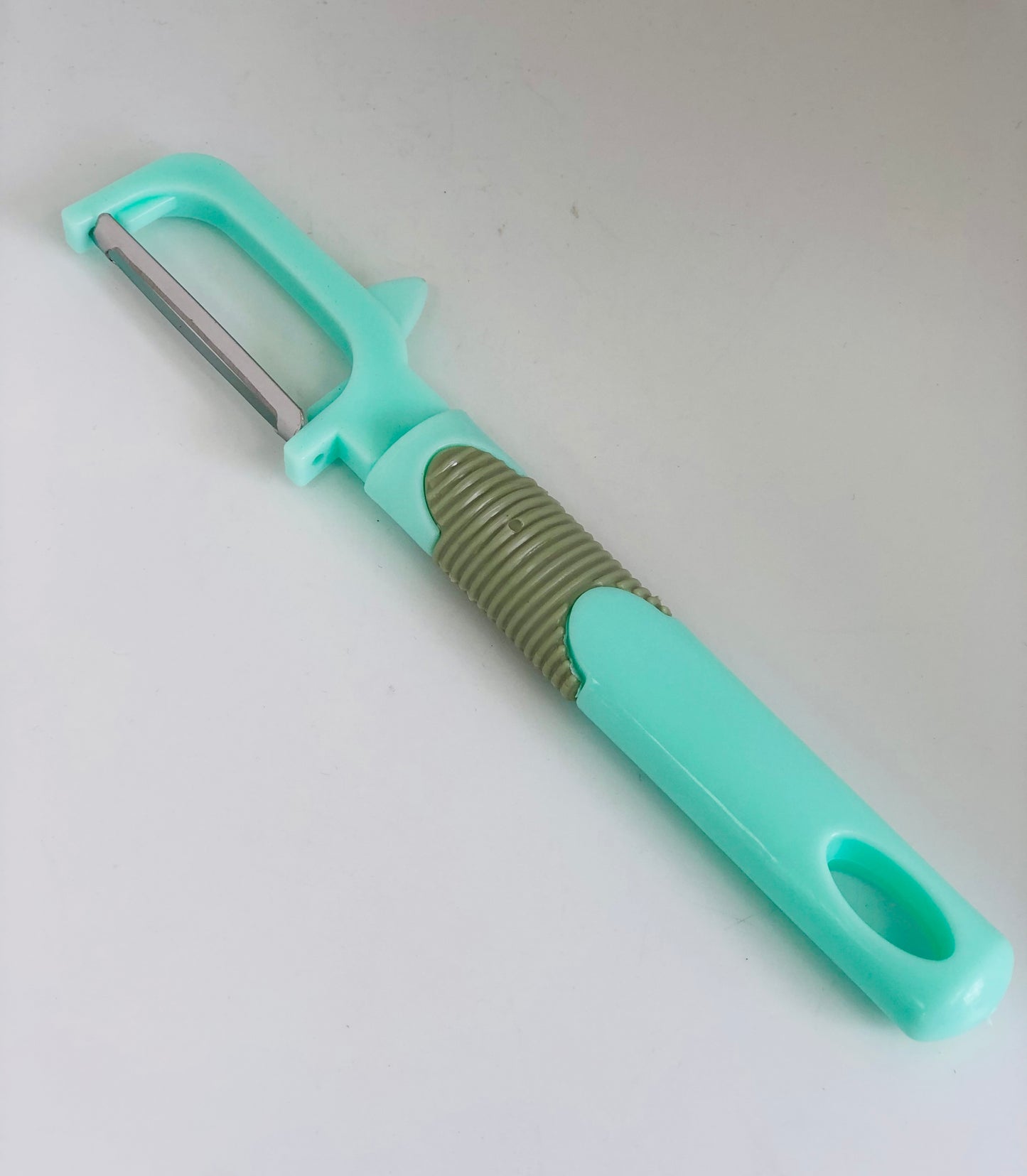 Peeler with folding knife