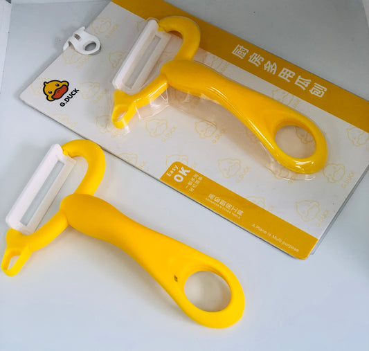 Yellow food peeler