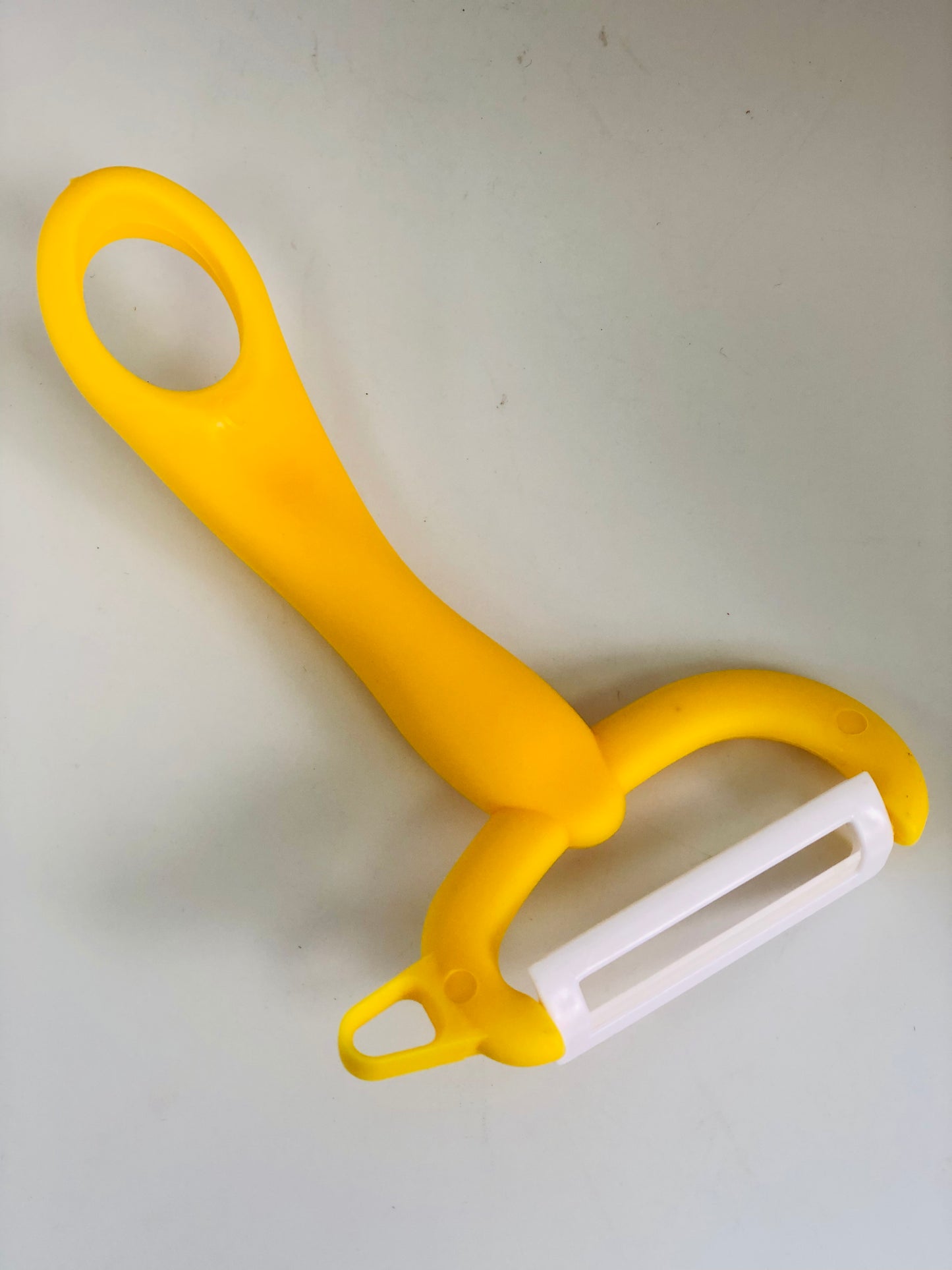 Yellow food peeler