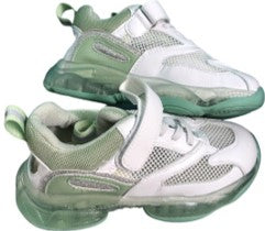 White and green shoes with an opening at the back