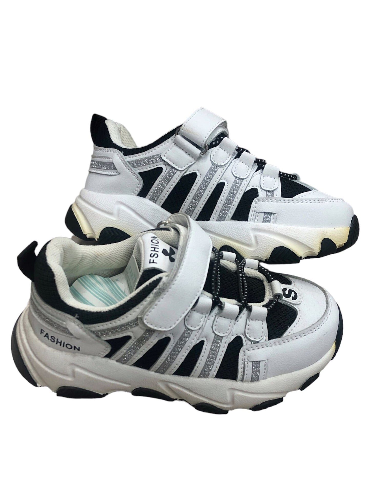 Black and white children's shoes with lace and adhesive