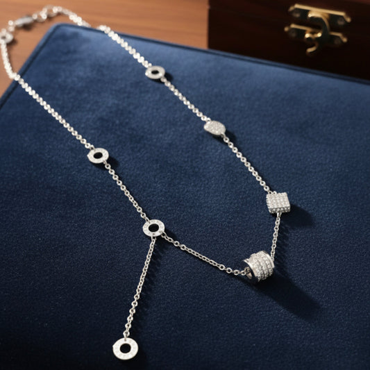 Long cylinder necklace, gold and silver