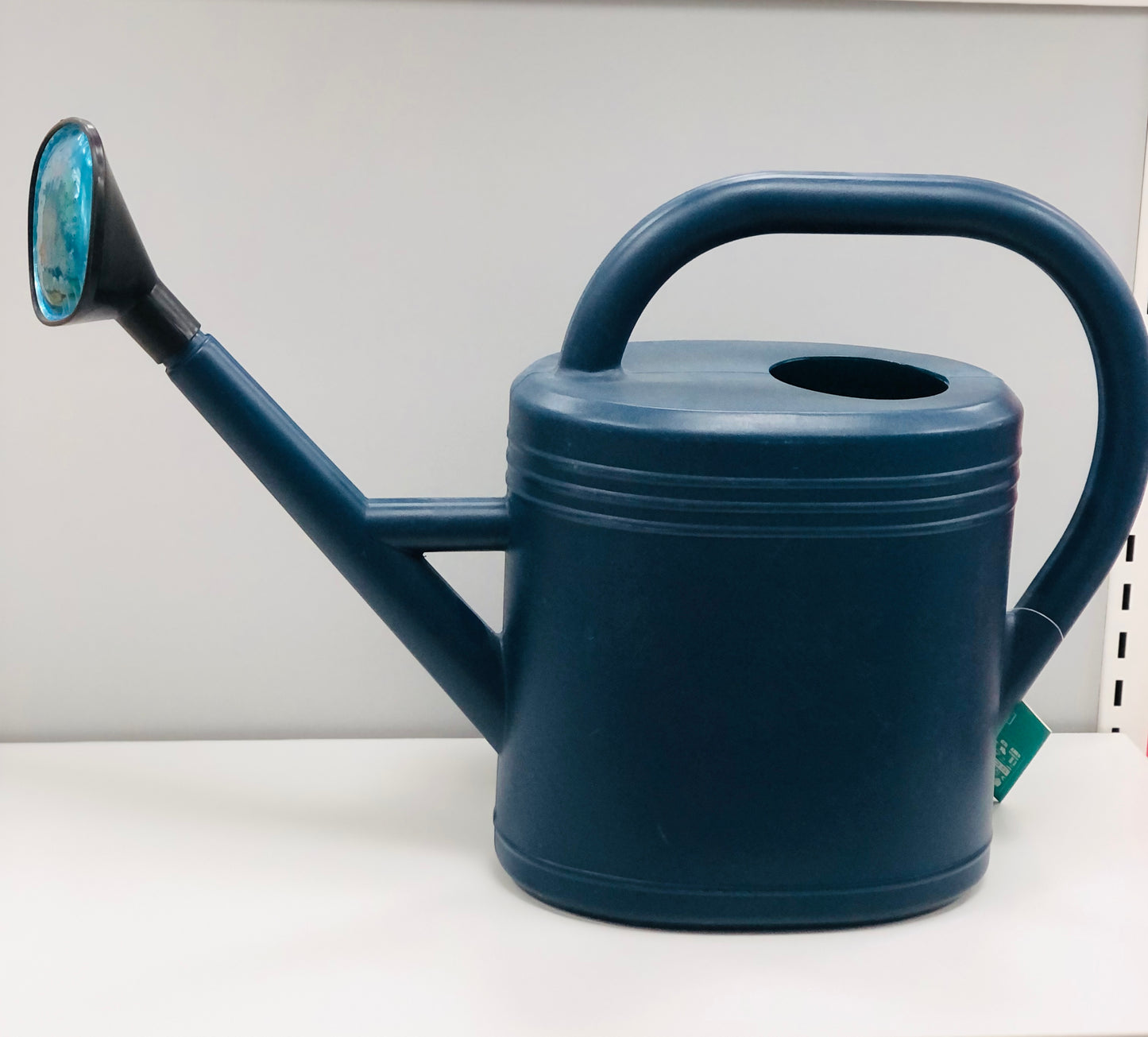 A jug for irrigation of crops with a sprinkler