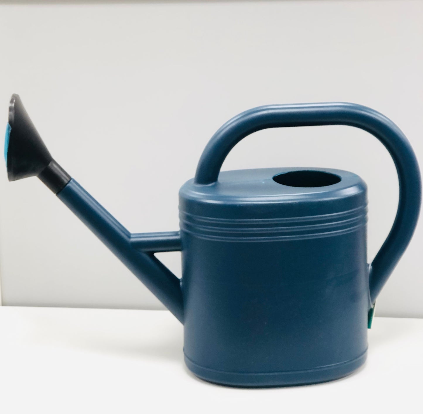 A jug for irrigation of crops with a sprinkler